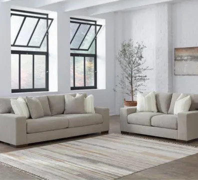 Ensemble de salon moderne comprenant un canapé 3 places et un canapé 2 places en tissu beige, pour un intérieur contemporain et lumineux. Ameublement Hicham.